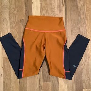 ALO Yoga Orange and Black Leggings